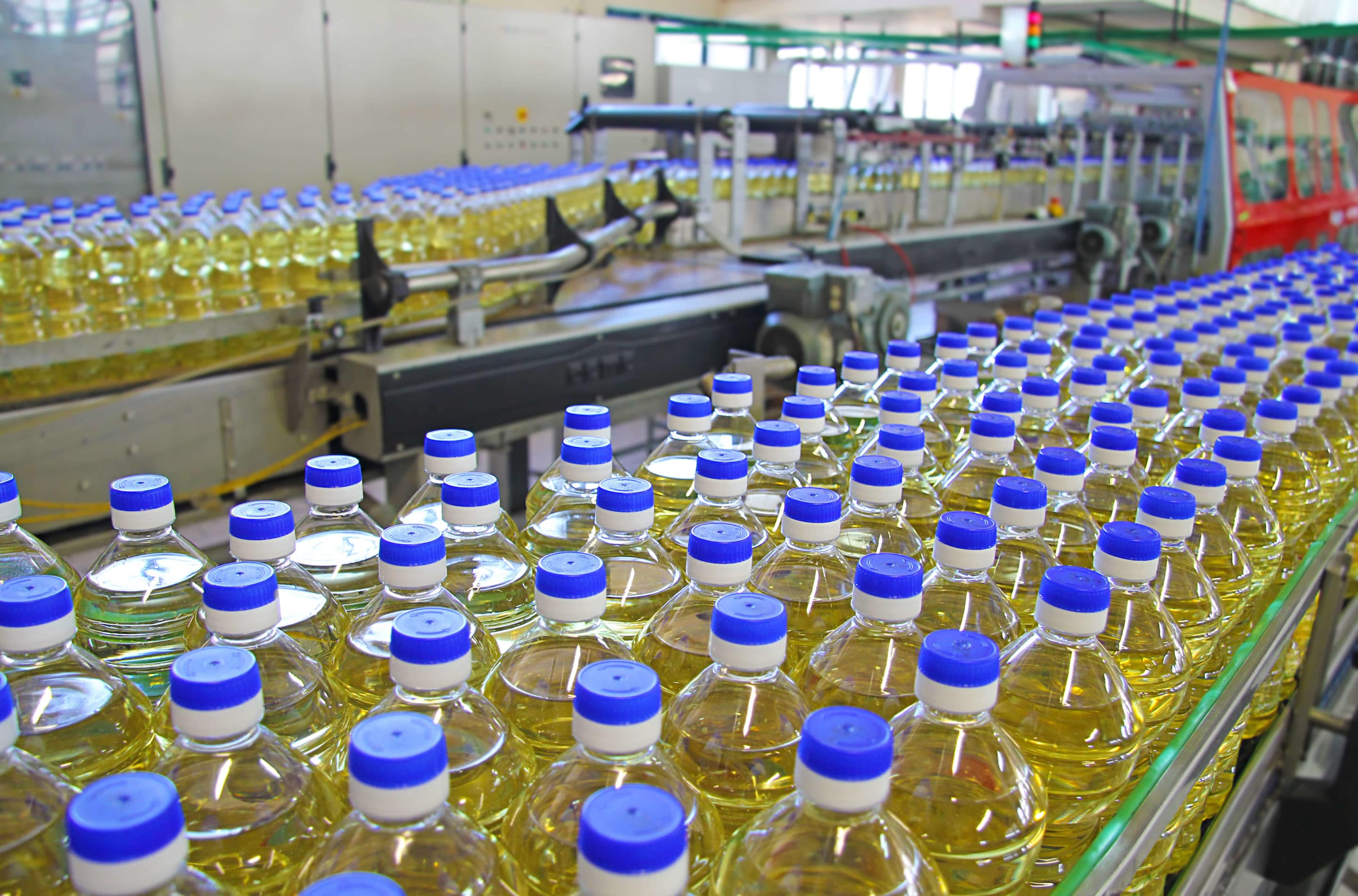 Defect Tracking Line with sunflower oil bottles on an assembly line